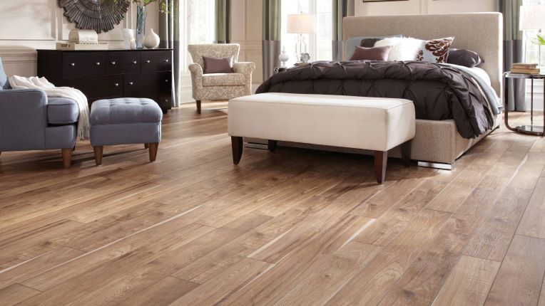 wood look laminate flooring in a stylish bedroom