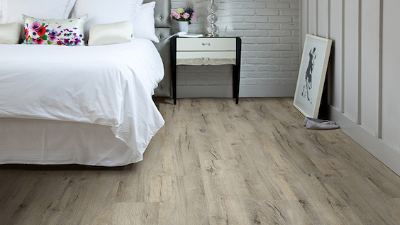 rustic luxury vinyl plank flooring in a bedroom